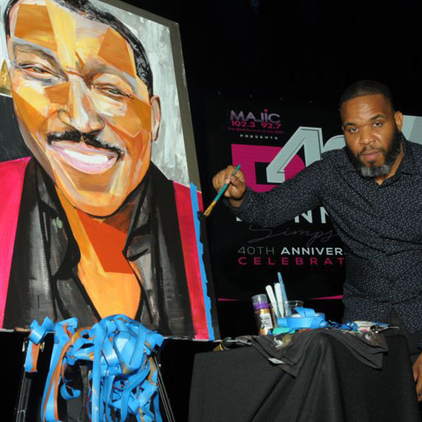 Artist with painting of Donnie.