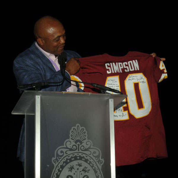 Brian Wilson, former Redskins player presents Donnie with autographed jersey for 40th Anniversary.